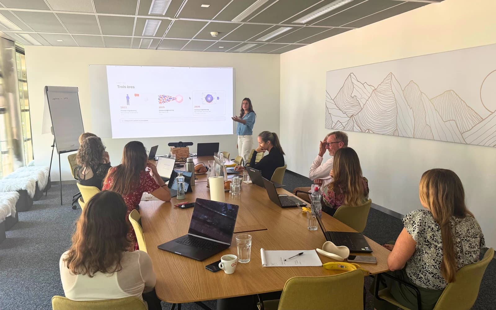 Romane, AI trainer at DKDP, leads a training session for a company team on its premises in Geneva